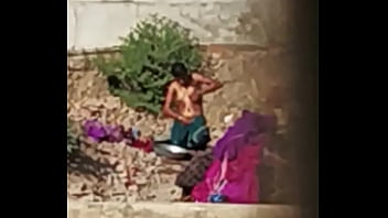 Bare And Beautiful In The Open Air, A Dasi Indian Woman Bathes Freely