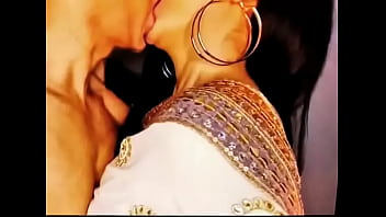 A Passionate Kiss From An Indian Wife In A White Saree And Sleeveless Blouse, Her Big Earrings Swaying As She Embraces Her Husband