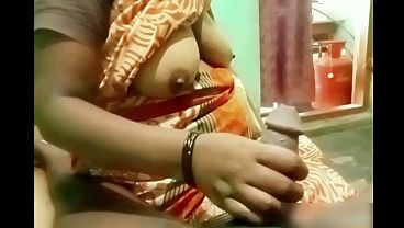 Indian Aunty’s Hand Sliding On A Young Boy’s Stiff Cock